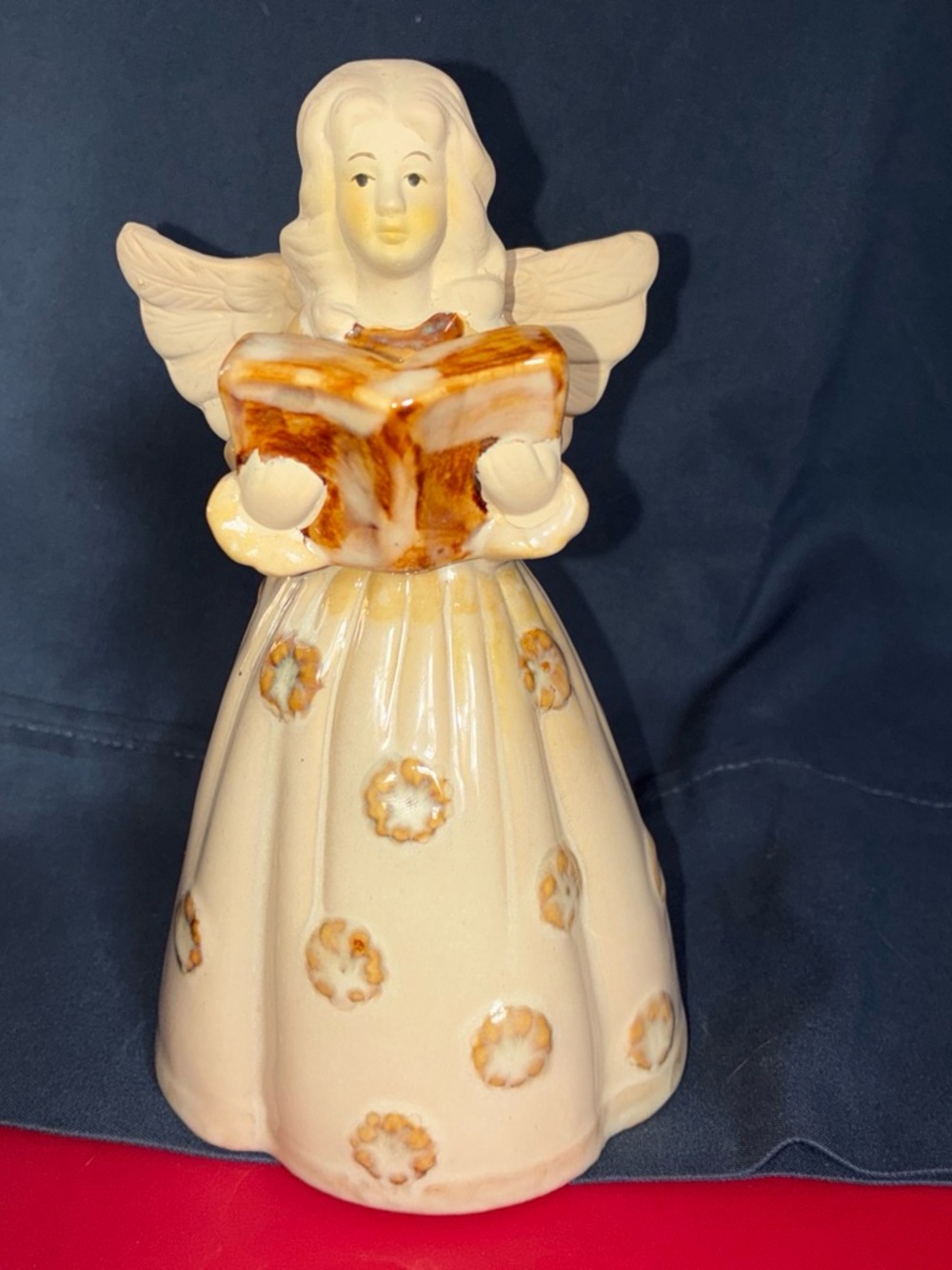447.     Ceramic Angel Figurine Holding a Book - Cream and Brown